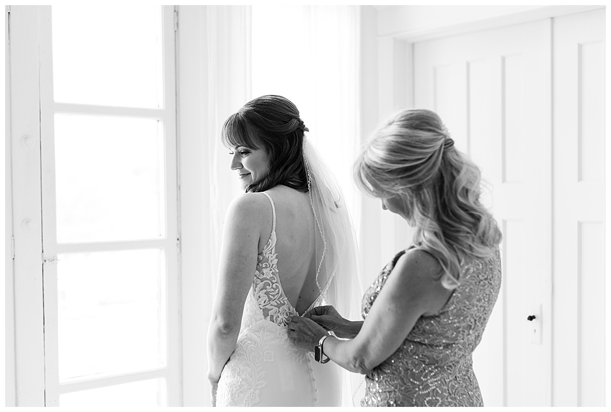 Bride getting dressed for capitol room wedding