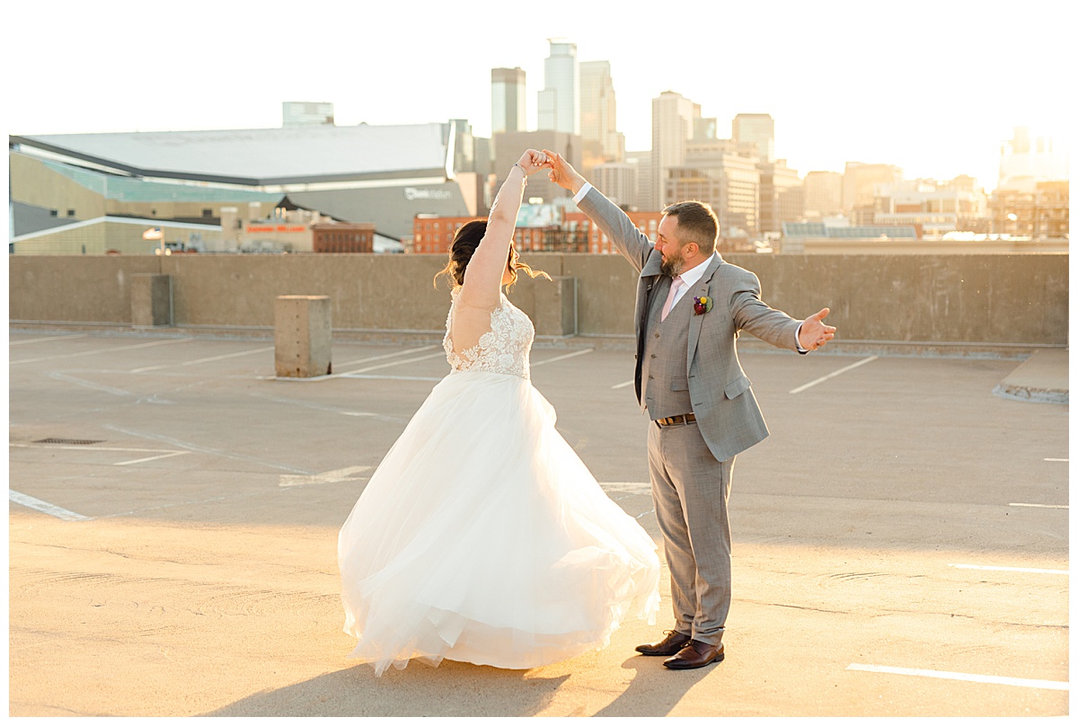 Bride and groom dancing at sunset