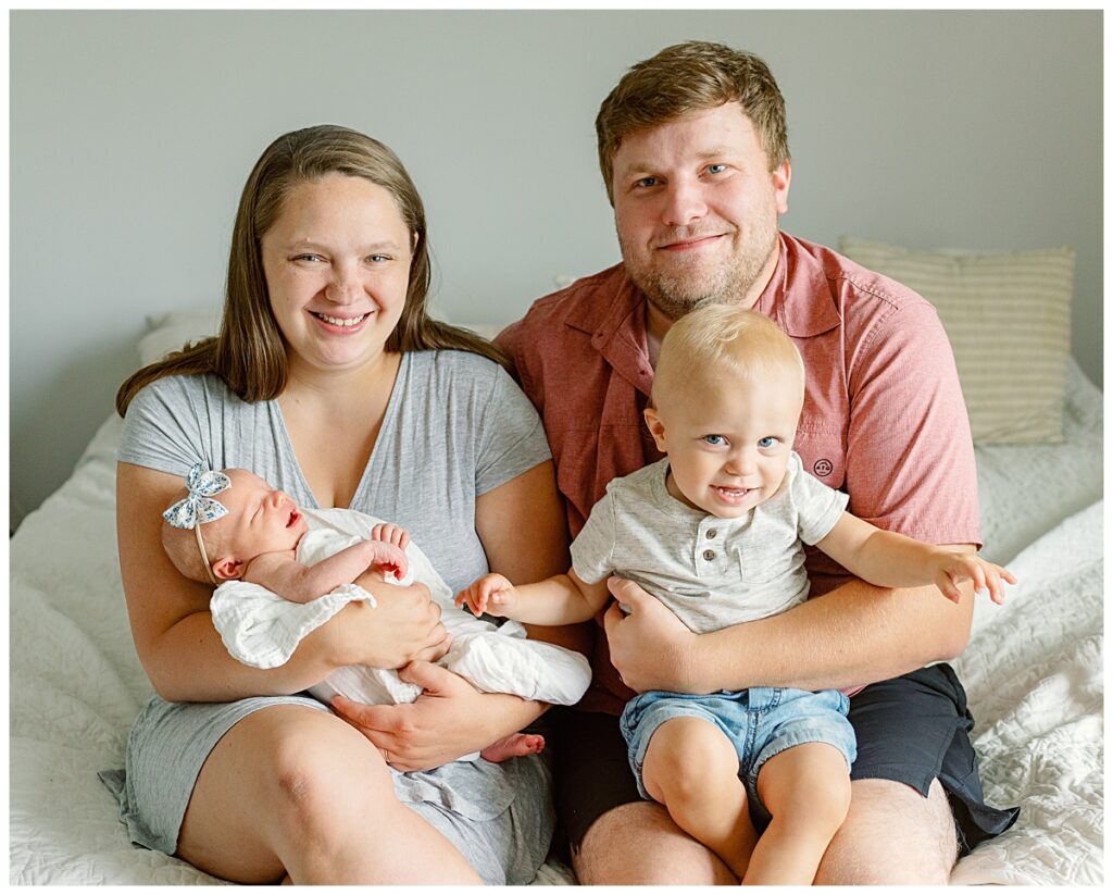 family with newborn baby in home photographer