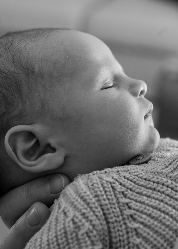 Best Time to Take Newborn Photos | Bauer Creative The best time to take newborn photos is when baby is calm, fed and happy like this baby sleeping in his mama's arms.