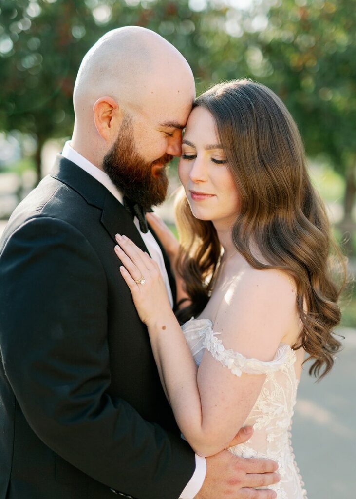 Wedding photographers in Minneapolis, MN capturing a couple sharing a quiet, intimate moment outdoors
