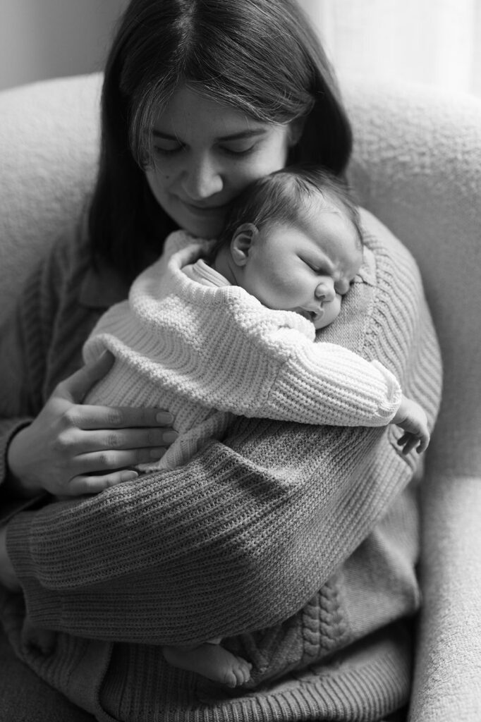 Mom and baby posing for Twin Cities newborn photography session.