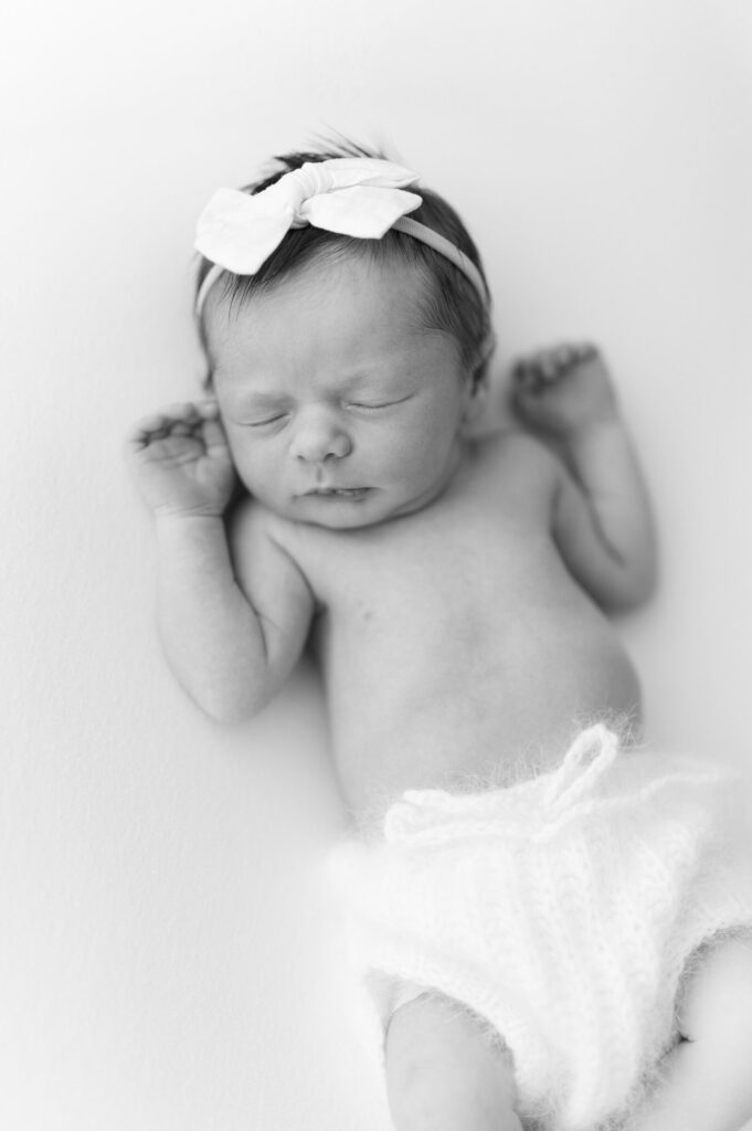 Baby posing for newborn photography in the Twin Cities.